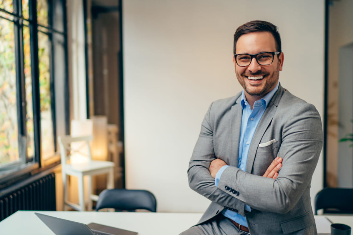 A smiling man in his office