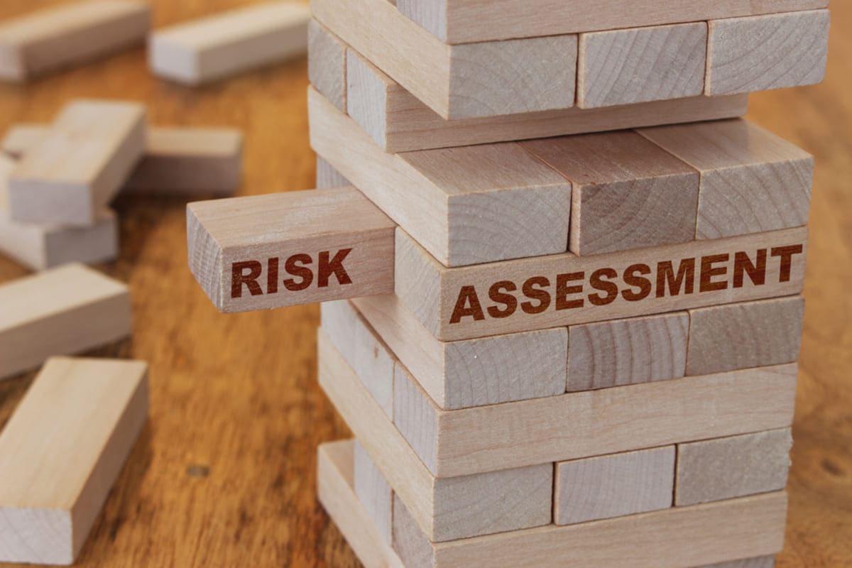 Stacked wooden blocks that say risk assessment