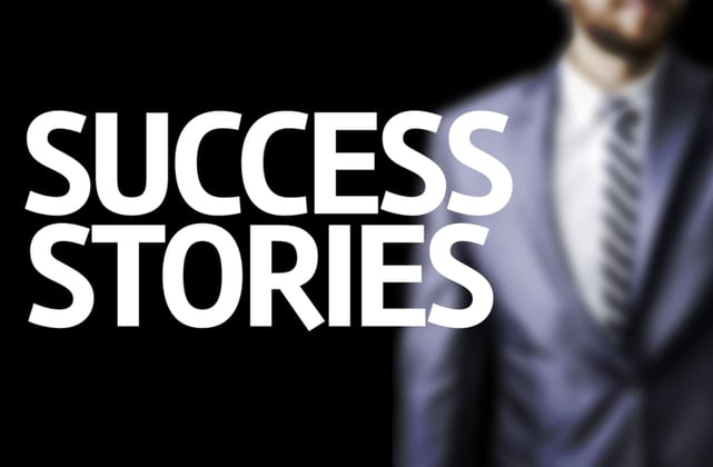 The words success stories in front of a blurred background of a man in a business suit