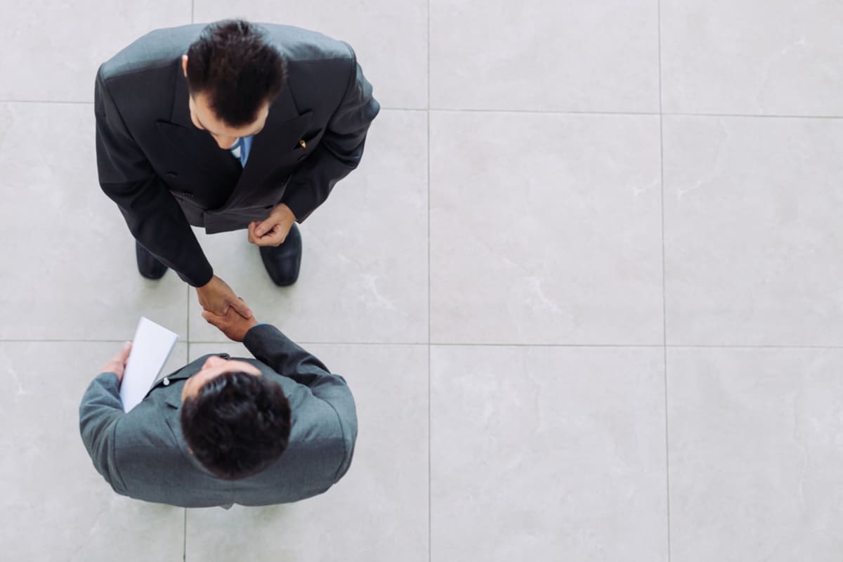 Two businessmen shaking hands.